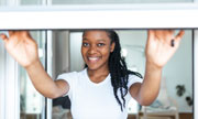 woman closing a window