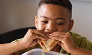 boy eating a sandwich