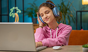 girl listening to music through headphones