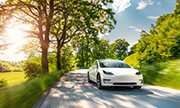 electric car driving down a road